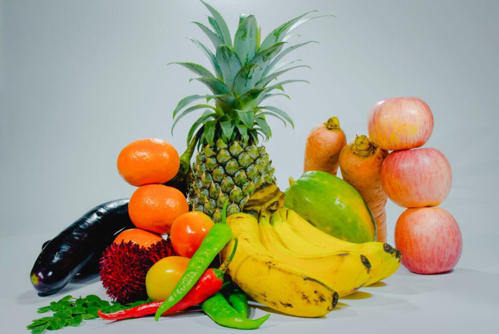 A colorful display of fresh tropical fruits and vegetables for healthy eating. Best Nigerian Dishes