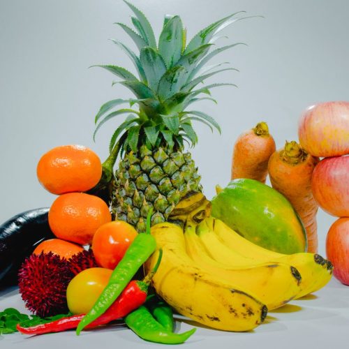 A colorful display of fresh tropical fruits and vegetables for healthy eating. Best Nigerian Dishes